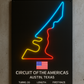Neon sign of Circuit of the Americas in Austin, Texas on a concrete wall.