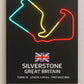 Neon light map of Silverstone Circuit with British flag and race details on a black background