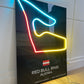 Neon light display of a race track layout with 'Red Bull Ring Austria' branding.