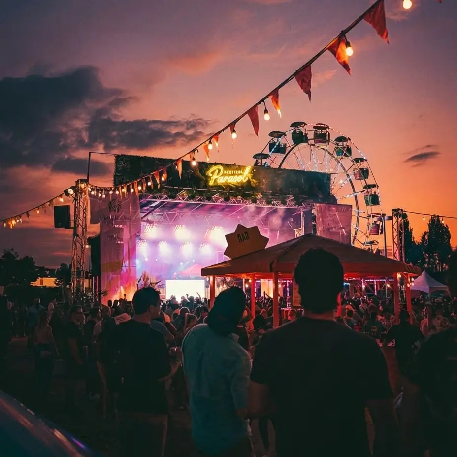 festival stage with light up custom outdoor neon sign on top of the stage for branding