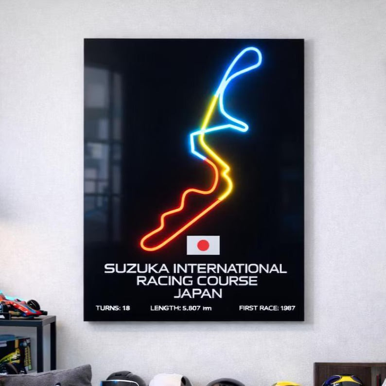 Neon light art of a racing track with text on a wall