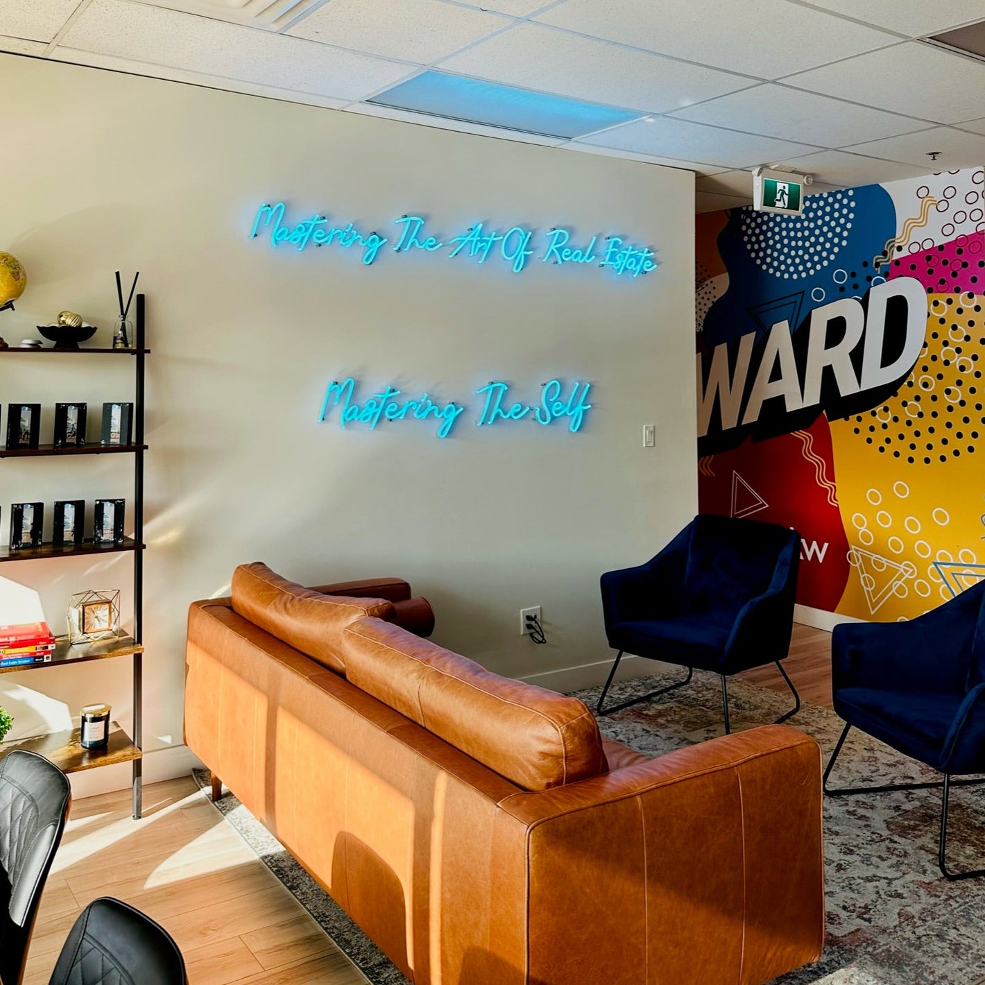 neon sign for real estate office saying mastering the art of real estate