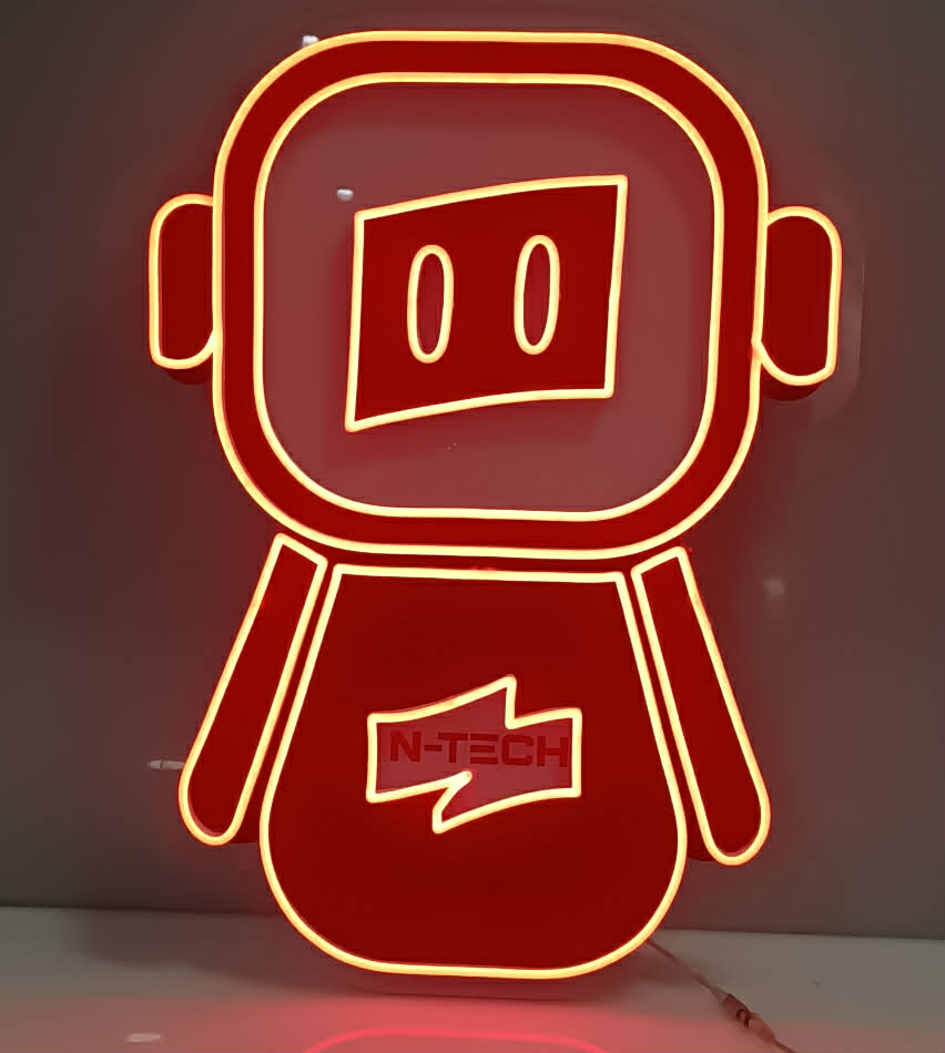 Neon sign of a robot with 'IN-TECH' branding on a dark background