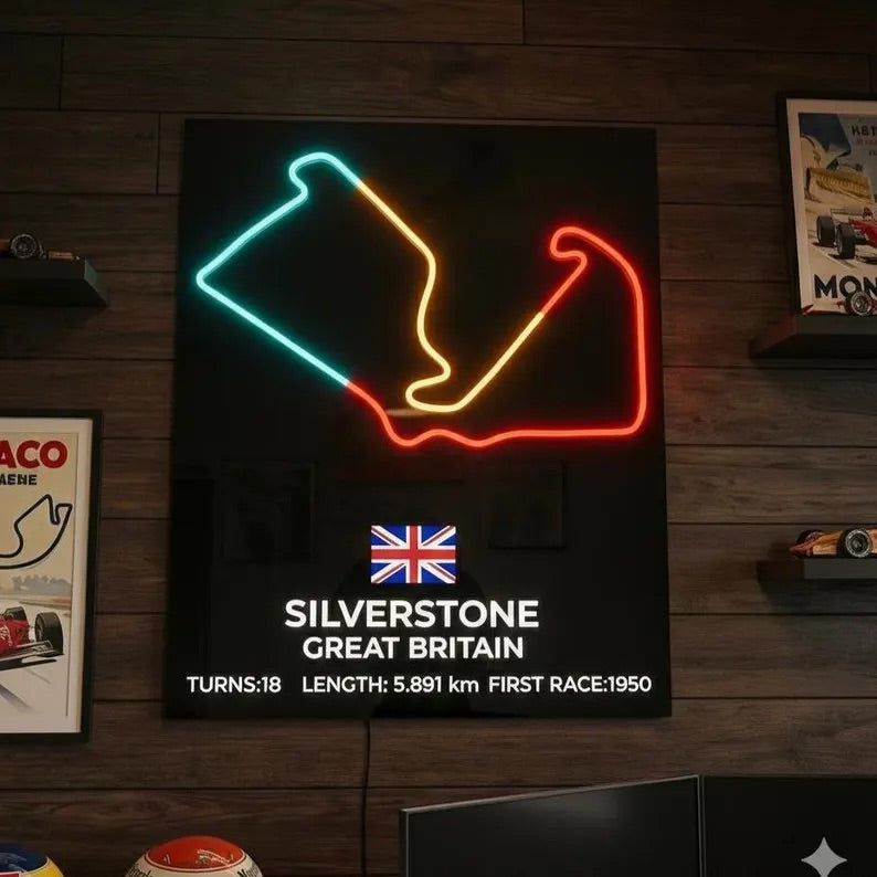 Neon sign of Silverstone circuit layout on a wooden wall with racing memorabilia.