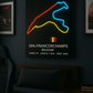 Neon light display of Spa-Francorchamps track layout on a dark wall.