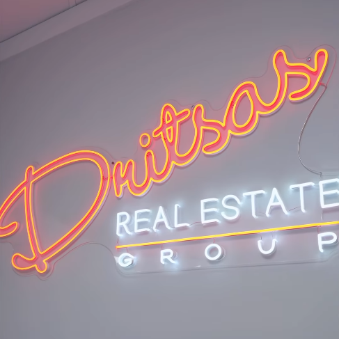 real estate office neon sign dritsas real estate group