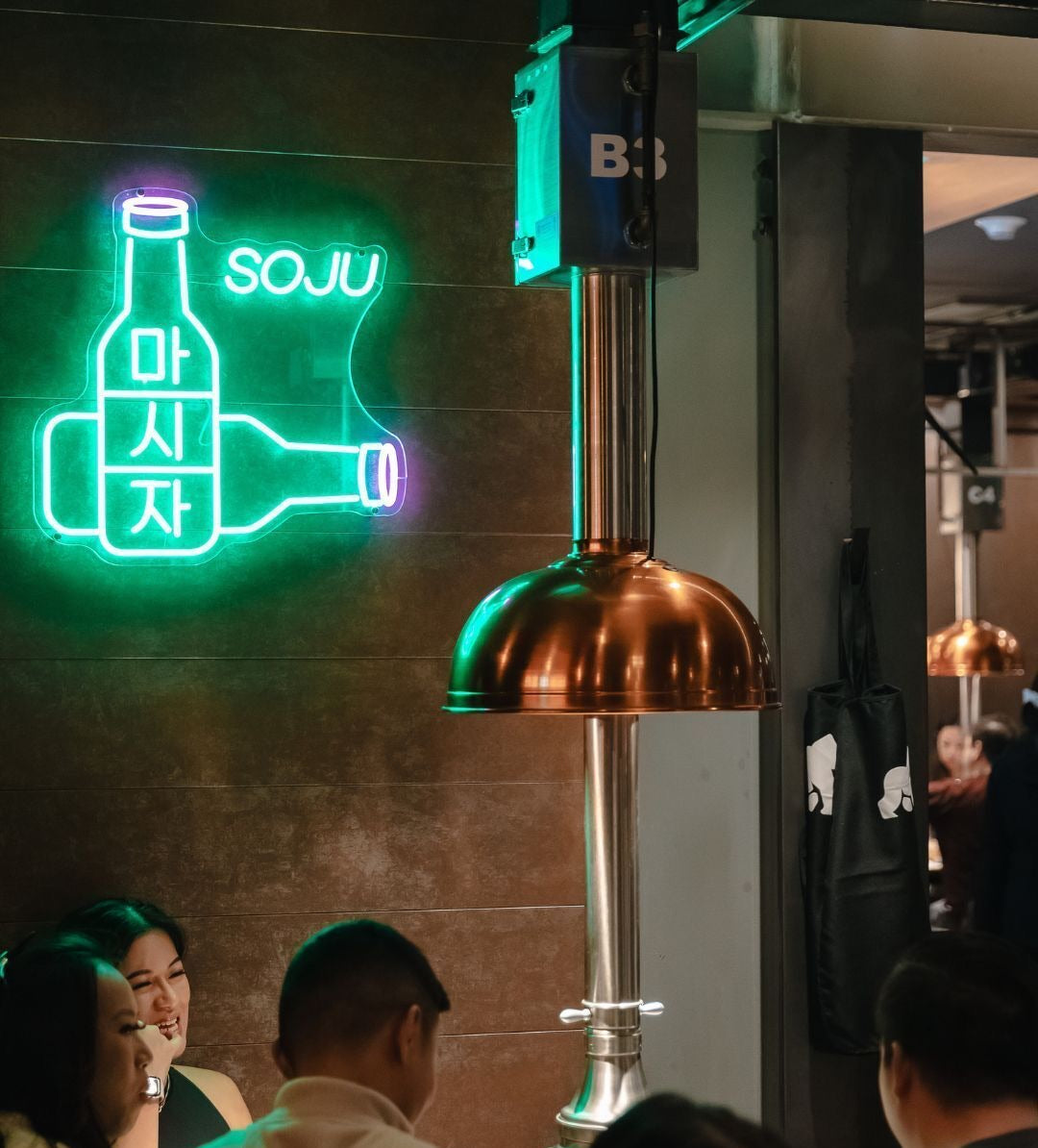 soju neon sign in a korean bbq restaurant